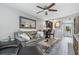 Relaxing living room, next to dining area and kitchen, featuring open floor plan and wood-look flooring at 3221 White Ibis Ct # C1, Punta Gorda, FL 33950