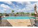 Inviting pool with brick-paved patio and waterfront views, perfect for relaxing and entertaining by the water at 3221 White Ibis Ct # C1, Punta Gorda, FL 33950