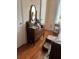 Cozy bedroom featuring a vintage dresser, hardwood floors, and natural light at 3585 41St S Way # D, St Petersburg, FL 33711