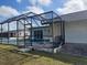 Backyard features a screened lanai over a large pool, seamlessly blending indoor and outdoor living at 4299 Bullard St, North Port, FL 34287