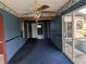 View of the dining room featuring a ceiling fan and sliding glass doors to the pool area at 4299 Bullard St, North Port, FL 34287