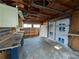 View of the garage featuring storage cabinets, work benches, and a garage door at 4299 Bullard St, North Port, FL 34287