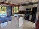 Bright kitchen with white cabinets, black appliances, and plenty of countertop space at 4299 Bullard St, North Port, FL 34287