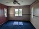 Living room showcasing a ceiling fan and large windows for plenty of natural light at 4299 Bullard St, North Port, FL 34287