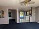 Living room view featuring an ceiling fan and an open floor plan at 4299 Bullard St, North Port, FL 34287