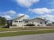 Side view of this house, showcasing its unique architectural design and landscaping at 4299 Bullard St, North Port, FL 34287