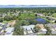 Beautiful aerial view of the neighborhood highlighting the pond and lush landscaping at 12519 Knollbrook Ln, Hudson, FL 34669