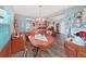 Charming dining room with wooden furniture, hardwood floors, and ample natural light at 12519 Knollbrook Ln, Hudson, FL 34669