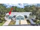 Charming exterior view of attached homes with well-maintained landscaping and private patios at 12519 Knollbrook Ln, Hudson, FL 34669