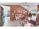 Spacious living room features beautiful wood floors, neutral paint and comfortable seating at 12519 Knollbrook Ln, Hudson, FL 34669