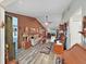 Spacious living room features beautiful wood floors, neutral paint and comfortable seating at 12519 Knollbrook Ln, Hudson, FL 34669