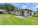 This property features a well-maintained backyard with lush green grass and a patio area at 6108 Penny Ln # 0, Bradenton, FL 34207