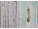 Bathroom with flamingo shower curtain and mirrored door at 6108 Penny Ln # 0, Bradenton, FL 34207