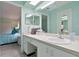 Bright bathroom with white vanity, decor and large mirrors at 6108 Penny Ln # 0, Bradenton, FL 34207