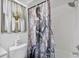 Bathroom with decorative mermaid shower curtain and coastal accents at 6108 Penny Ln # 0, Bradenton, FL 34207