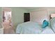 Bedroom featuring a large bed and portable wardrobe at 6108 Penny Ln # 0, Bradenton, FL 34207