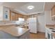 Well-lit kitchen featuring wood cabinets and functional layout at 6108 Penny Ln # 0, Bradenton, FL 34207