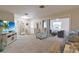 Bright living room with neutral tones and sliding glass doors to lanai at 6108 Penny Ln # 0, Bradenton, FL 34207