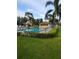 Relaxing community pool with lush landscaping and poolside cabana for residents to enjoy at 6108 Penny Ln # 0, Bradenton, FL 34207