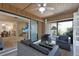 Inviting sunroom featuring wicker furniture, ceiling fan, and sliding doors at 6108 Penny Ln # 0, Bradenton, FL 34207
