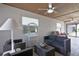 Relaxing sunroom featuring wicker furniture, tile flooring, and multiple windows at 6108 Penny Ln # 0, Bradenton, FL 34207