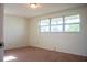 Light-filled bedroom with a large window and neutral walls, offering a peaceful retreat at 2616 Bayshore Gardens Pkwy, Bradenton, FL 34207