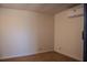 Bedroom features neutral walls, carpet, and an air conditioner for comfortable living at 2616 Bayshore Gardens Pkwy, Bradenton, FL 34207