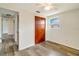 Bedroom featuring vinyl floors and a wooden closet at 2616 Bayshore Gardens Pkwy, Bradenton, FL 34207