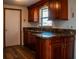 Beautiful kitchen featuring custom cabinetry, sleek granite countertops, and modern fixtures at 2616 Bayshore Gardens Pkwy, Bradenton, FL 34207