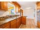 Well-equipped kitchen showcasing wood cabinets and granite countertops at 2616 Bayshore Gardens Pkwy, Bradenton, FL 34207