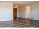 Open-concept living room featuring new flooring and fresh neutral paint, ready for your personal touches at 2616 Bayshore Gardens Pkwy, Bradenton, FL 34207