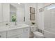 Bright bathroom with white vanity, modern fixtures, and tub with subway tile surround at 2945 Cascabel Ter, North Port, FL 34286