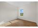 Clean and simple bedroom with hardwood floors and natural light from the window at 2945 Cascabel Ter, North Port, FL 34286