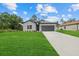 Charming single-story home featuring a well-manicured lawn and a two-car garage at 2945 Cascabel Ter, North Port, FL 34286