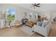 Comfortable living room area with modern decor, hardwood floors, and plenty of natural light at 2945 Cascabel Ter, North Port, FL 34286