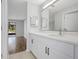 Bathroom boasts a modern vanity and is adjacent to the living room at 623 Sandy Creek Dr, Brandon, FL 33511