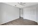 Bedroom featuring a ceiling fan, closet and wood-look floors at 623 Sandy Creek Dr, Brandon, FL 33511