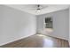 This room features a ceiling fan, wood-look floors and view of the backyard at 623 Sandy Creek Dr, Brandon, FL 33511