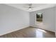 Bedroom with neutral color palette, wood-look flooring, and a bright window at 623 Sandy Creek Dr, Brandon, FL 33511