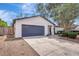 Traditional-style home boasts a private driveway, manicured lawn, and attached garage, presenting curb appeal at 623 Sandy Creek Dr, Brandon, FL 33511