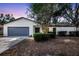 Charming single-story home featuring a well-maintained lawn, mature landscaping, and an attached two-car garage at 623 Sandy Creek Dr, Brandon, FL 33511