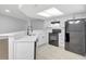 Bright and modern kitchen featuring white cabinetry, black appliances, and light countertops at 623 Sandy Creek Dr, Brandon, FL 33511