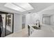 Modern kitchen features stainless steel sink, updated countertops, white cabinetry, and plenty of natural light at 623 Sandy Creek Dr, Brandon, FL 33511