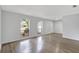 Open living room featuring sleek flooring, natural light from several windows, and a neutral color palette at 623 Sandy Creek Dr, Brandon, FL 33511