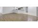 Open concept living space with new flooring connecting the living area and modern kitchen at 623 Sandy Creek Dr, Brandon, FL 33511
