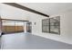 Covered outdoor patio with a gray sealed floor, large windows, and screen door at 623 Sandy Creek Dr, Brandon, FL 33511