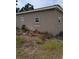 Exterior side view of the home shows the structure and yard at 1609 W Maki Rd, Plant City, FL 33566