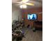 View of a cluttered living room featuring a TV at 1609 W Maki Rd, Plant City, FL 33566