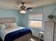 Relaxing bedroom with a ceiling fan, a window, and neutral color scheme at 13122 Cumberland Dr, Largo, FL 33773