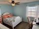 Bedroom featuring coral accents, wood-look floors, a window, and a desk space at 13122 Cumberland Dr, Largo, FL 33773